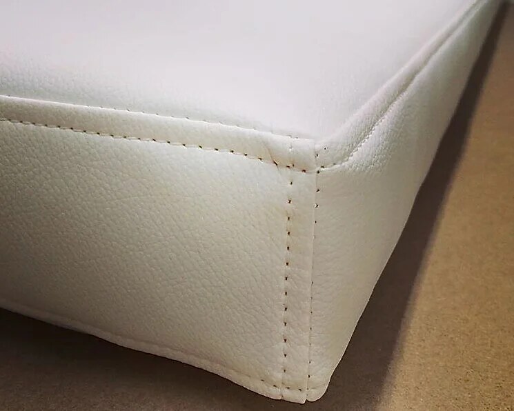 Convertible boat seating with bespoke cushions that fold out into a sun pad