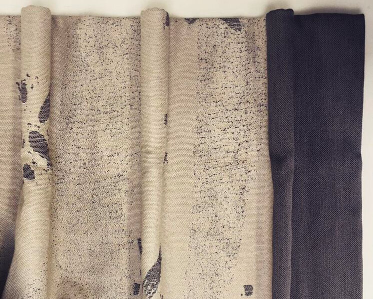 Close view of printed linen curtains with a contrasting dark border