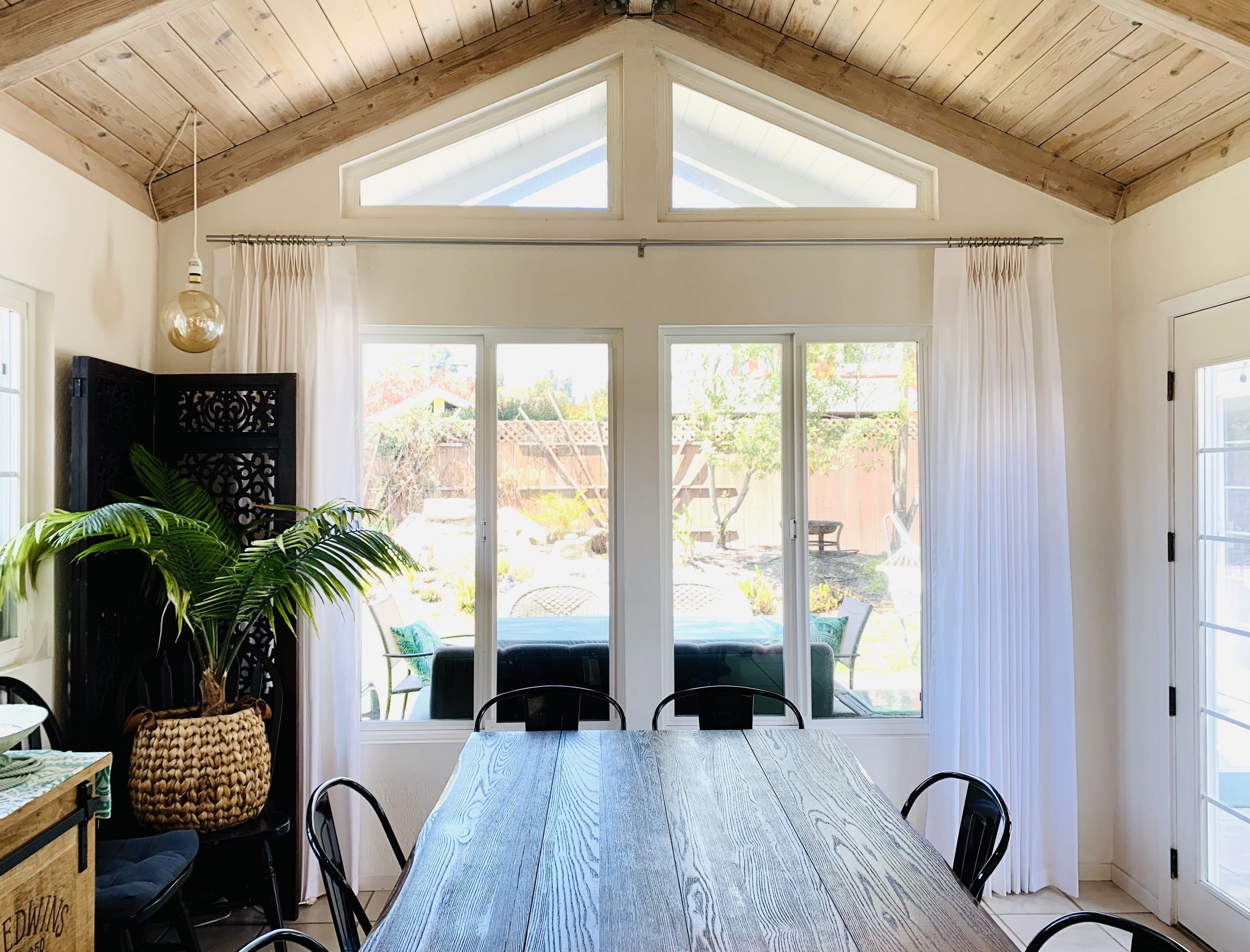 Dining room with full-length made-to-measure curtains
